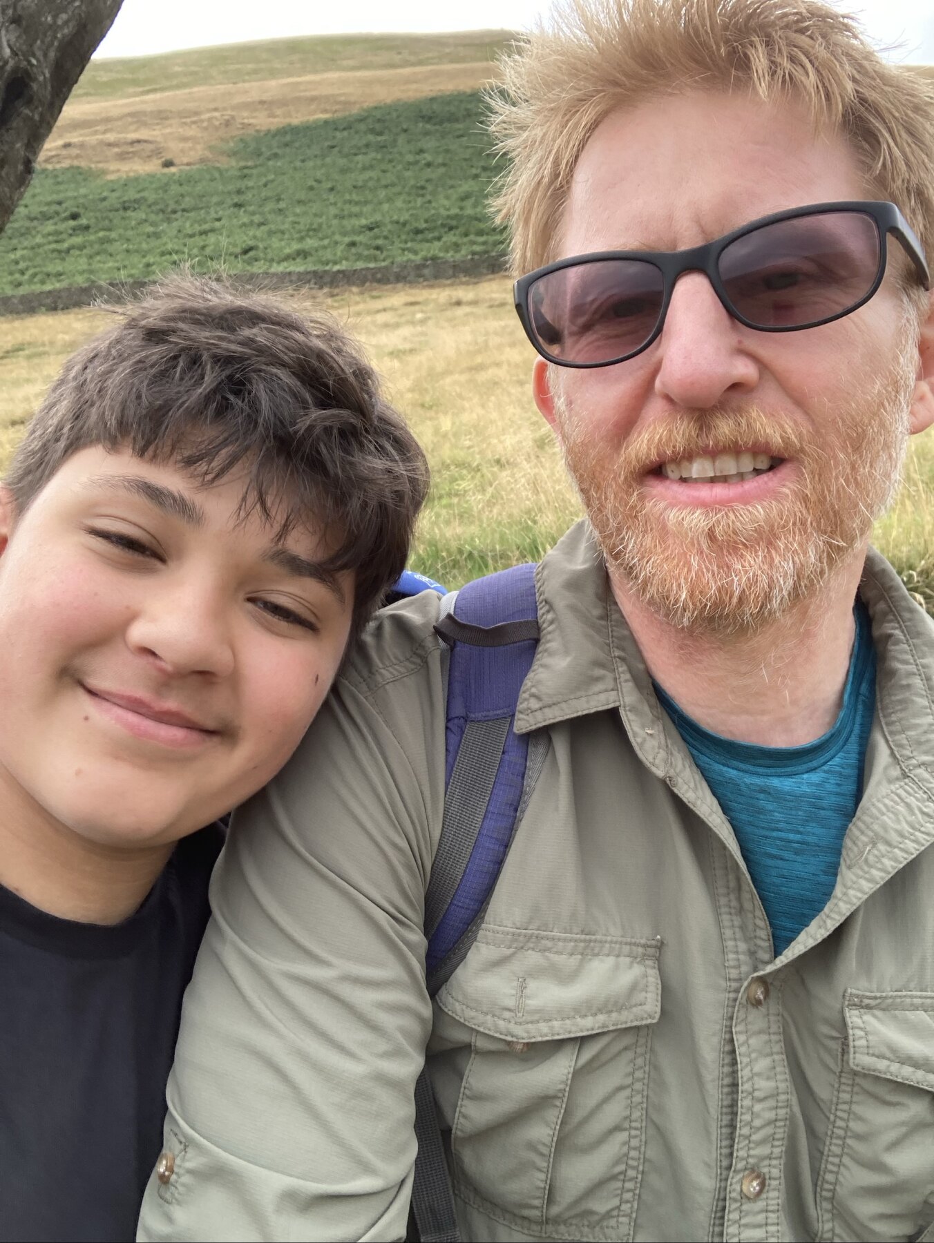 Grandad and Blake smiling together on a walk.